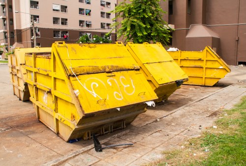 Construction site with various waste materials being sorted