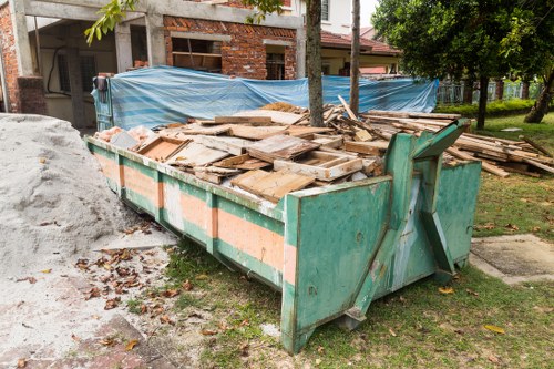 Customer receiving a skip from Eltham Skip Hire
