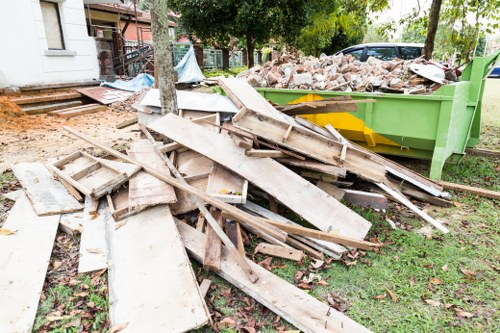 Workers complying with local waste disposal regulations